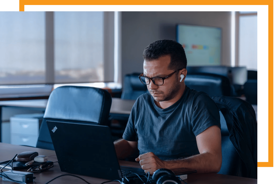 Alter Solutions developer working at the computer